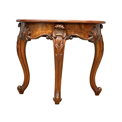 920 - A Victorian Burr Walnut and mahogany Demi Lune hall table on cabriole legs. Circa 1860. 78x50.5x68cm... 