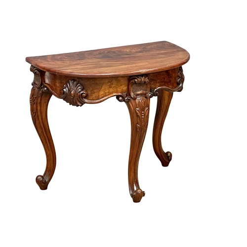 920 - A Victorian Burr Walnut and mahogany Demi Lune hall table on cabriole legs. Circa 1860. 78x50.5x68cm... 