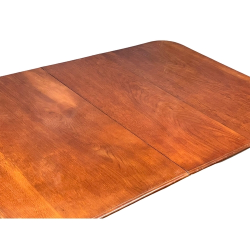 922 - A Victorian mahogany wind out dining table with leaf and winder. 180x126x73cm (10)