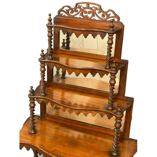 923 - A Victorian mahogany 6 tier mirror back whatnot shelving unit with Barley Twist supports. 66x30x155c... 