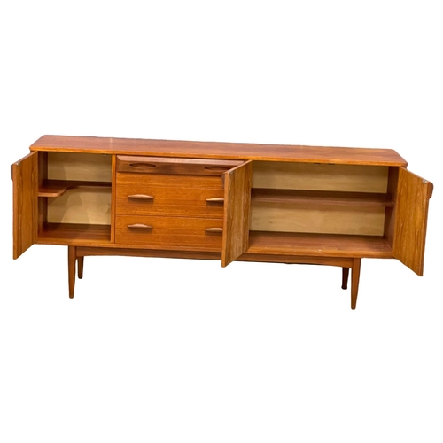 924 - A 1960’s Mid Century teak sideboard by Wright & Newton. 182x42x76cm (2)