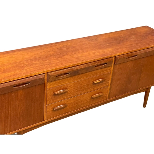 924 - A 1960’s Mid Century teak sideboard by Wright & Newton. 182x42x76cm (2)