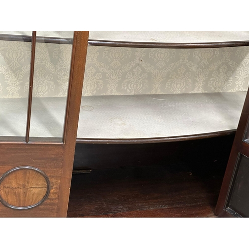 926 - A large Edwardian mahogany bow front display cabinet on splayed feet. 122x42x175.5cm (6)