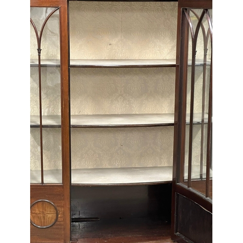 926 - A large Edwardian mahogany bow front display cabinet on splayed feet. 122x42x175.5cm (6)