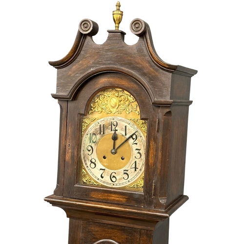 928 - An early 20th century oak long case clock with brass and pendulum. 197cm (4)