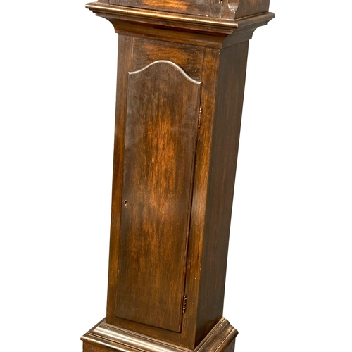 928 - An early 20th century oak long case clock with brass and pendulum. 197cm (4)