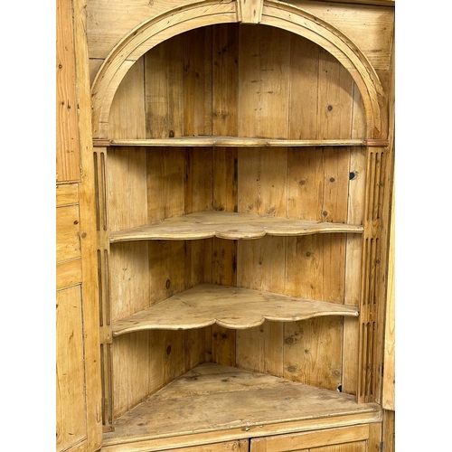 939 - A large late George III pine corner cabinet with fitted shelves and architectural interior. Circa 18... 