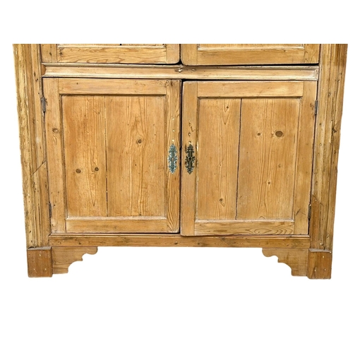 939 - A large late George III pine corner cabinet with fitted shelves and architectural interior. Circa 18... 