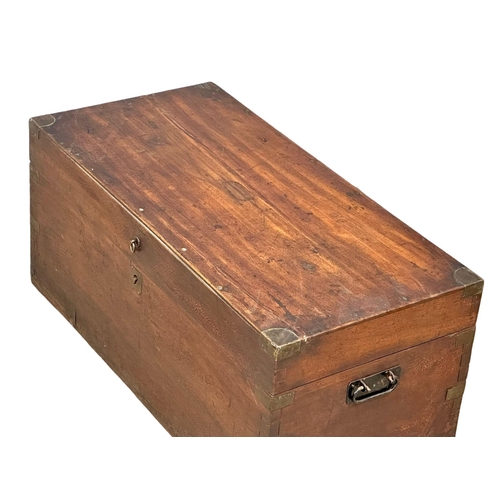 94 - A Victorian camphorwood campaign trunk. 84x41x38cm