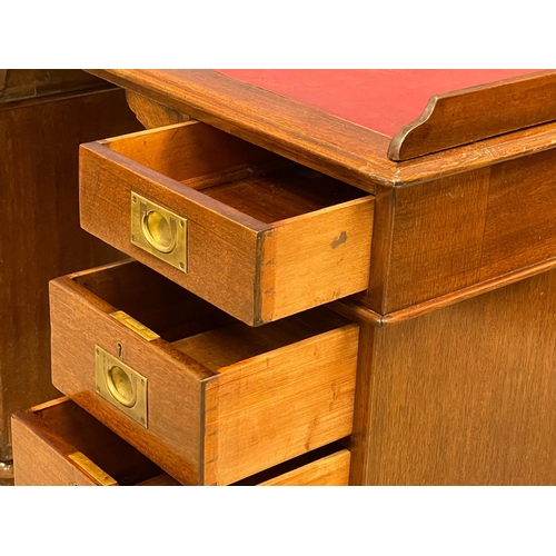 941 - A Victorian mahogany gallery back campaign desk with leather top. (13)