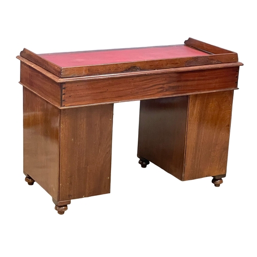 941 - A Victorian mahogany gallery back campaign desk with leather top. (13)