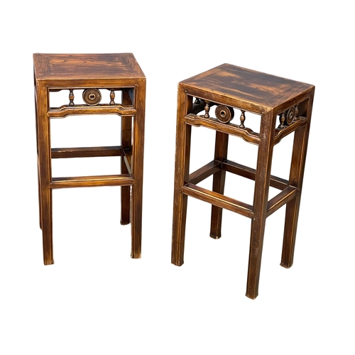 945 - A vintage Chinese Elm table and 4 stools. 100x65x113cm (12)