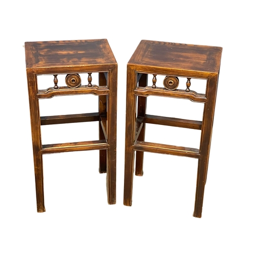 945 - A vintage Chinese Elm table and 4 stools. 100x65x113cm (12)