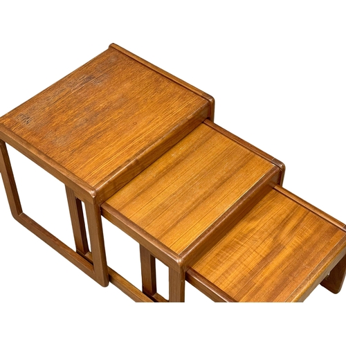 946 - A Mid Century teak nest of tables. (2)