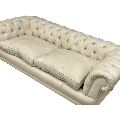 952 - A large good quality vintage deep button 2 seater sofa. 216cm (11)