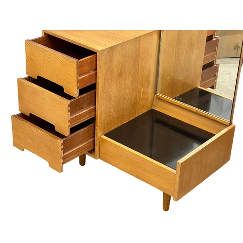 955 - A Mid Century oak ‘C Range’ dressing table designed by John & Sylvia Reid for Stag. 1960. 86x45x161c... 