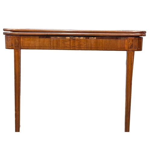 960 - A George IV inlaid mahogany turnover tea table. Circa 1820. 91x45x74cm (2)