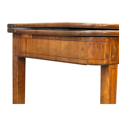 960 - A George IV inlaid mahogany turnover tea table. Circa 1820. 91x45x74cm (2)