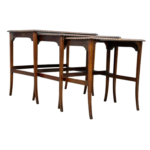 961 - A 1920’s mahogany nest of tables with gadrooning moulding on splayed feet. (8)