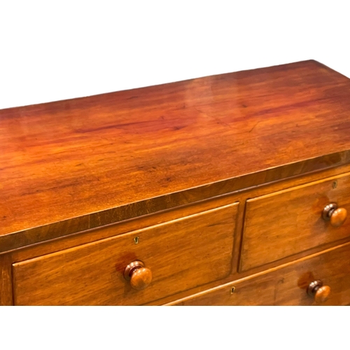 966 - A large Victorian mahogany chest of drawers with bun handles. 117x51x118cm (2)