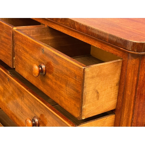 966 - A large Victorian mahogany chest of drawers with bun handles. 117x51x118cm (2)