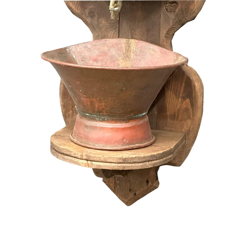 97 - A large late 19th century French garden copper and oak font. 100cm