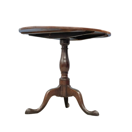 974 - A George III oak tilt top pedestal table. Circa 1780-1790. 78.5x67cm (2)