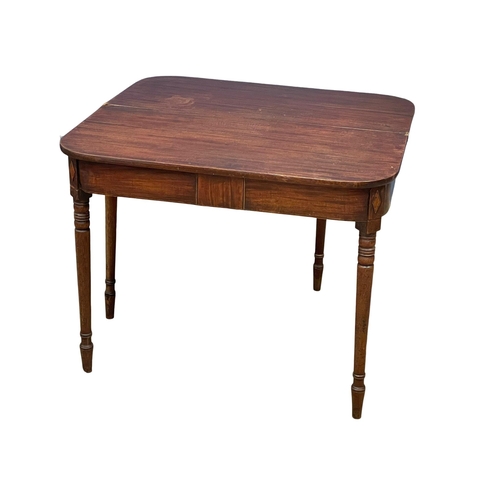 977 - A George IV inlaid mahogany turnover tea table. Circa 1820. 91x45x72.5cm (3)