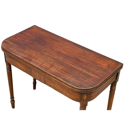 977 - A George IV inlaid mahogany turnover tea table. Circa 1820. 91x45x72.5cm (3)