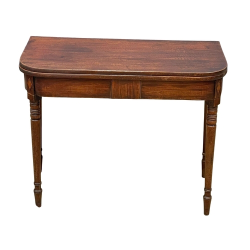 977 - A George IV inlaid mahogany turnover tea table. Circa 1820. 91x45x72.5cm (3)