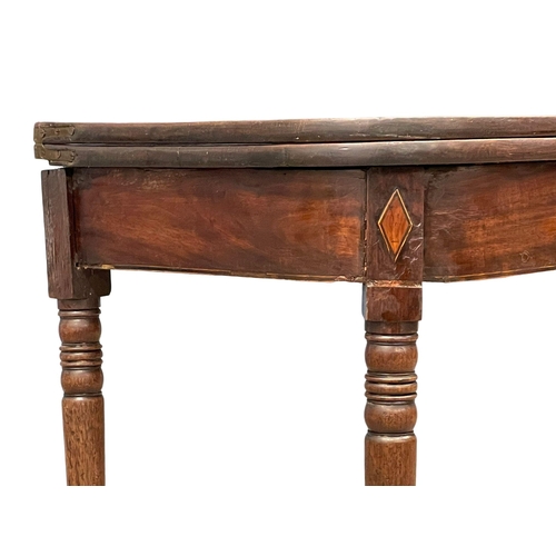 977 - A George IV inlaid mahogany turnover tea table. Circa 1820. 91x45x72.5cm (3)