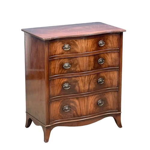 979 - A George III style mahogany serpentine front chest of drawers on splayed feet. 80.5x46.5x92cm
(3)