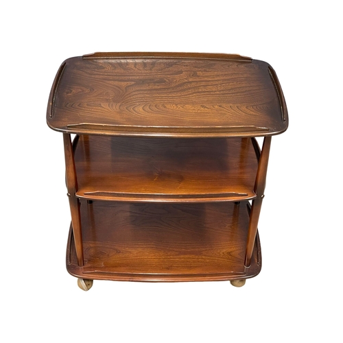 981 - An Ercol Mid Century Elm 3 tier serving trolley. Model 458. (3)