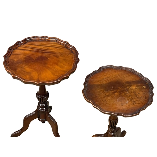 982 - A near pair of Georgian style mahogany pedestal wine tables. (2)