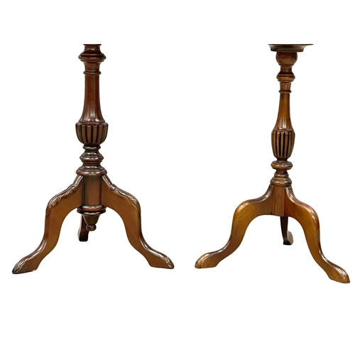 982 - A near pair of Georgian style mahogany pedestal wine tables. (2)