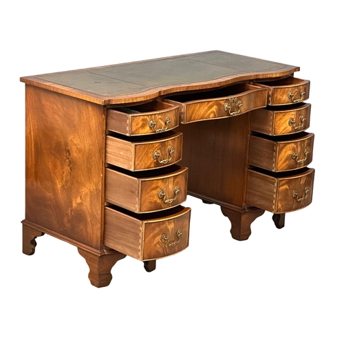 983A - A good quality Georgian style mahogany serpentine front writing desk with leather top. 115x52.5x74.5... 