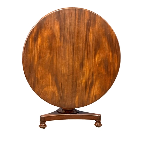 990 - A William IV mahogany tilt top pedestal breakfast table/dining table. 125x77cm (5)