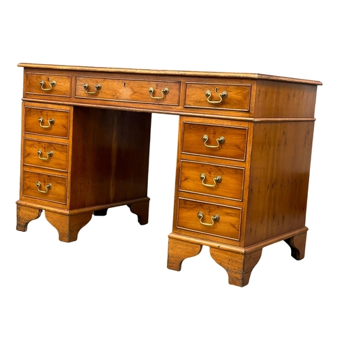 991 - A vintage Georgian style Yew Wood pedestal writing desk with leather top. 122x61x79cm (4)