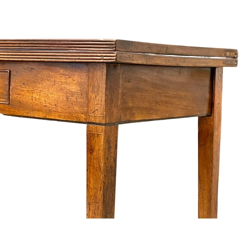 998 - A George III inlaid mahogany turnover tea table with drawer. Circa 1800 106.5x48x77cm (3)