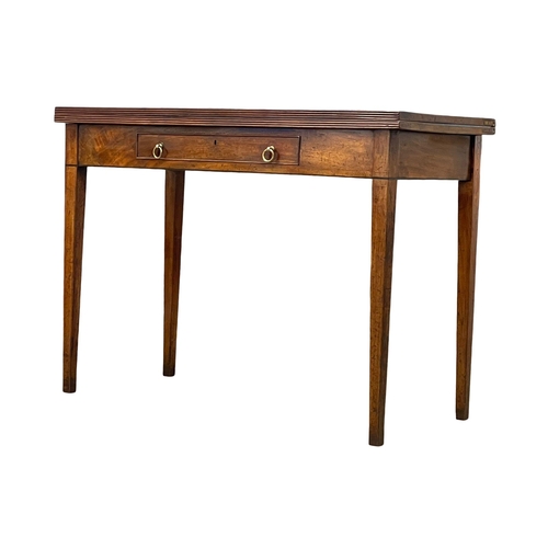 998 - A George III inlaid mahogany turnover tea table with drawer. Circa 1800 106.5x48x77cm (3)