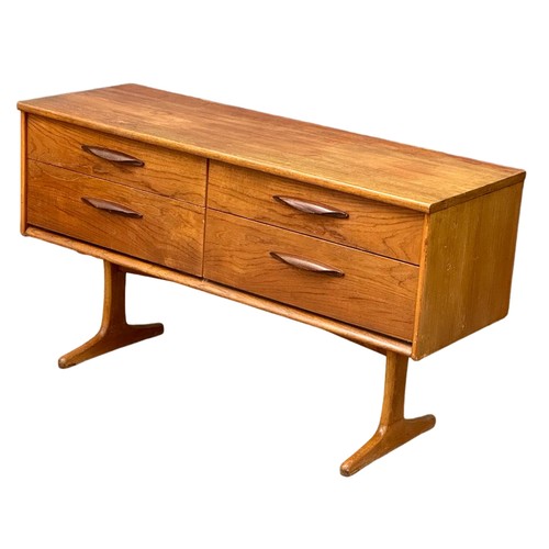 1130 - A Mid Century teak sideboard designed by Frank Guille for Austinsuite. 1960. 125.5x43x69.5cm (6)