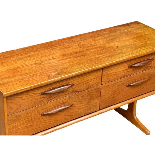 1130 - A Mid Century teak sideboard designed by Frank Guille for Austinsuite. 1960. 125.5x43x69.5cm (6)