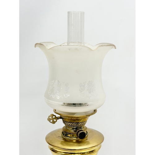 1 - A good quality late Victorian brass oil lamp by Evered & Co LTD, London. With later shade. 65cm