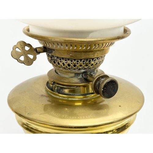 1 - A good quality late Victorian brass oil lamp by Evered & Co LTD, London. With later shade. 65cm