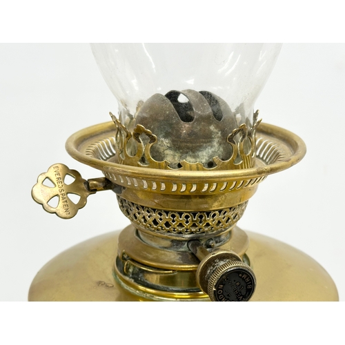 1 - A good quality late Victorian brass oil lamp by Evered & Co LTD, London. With later shade. 65cm