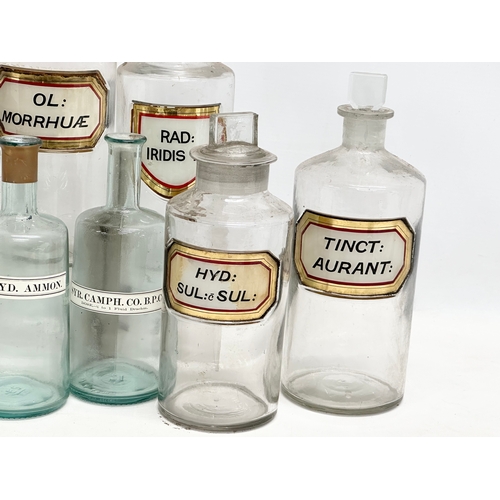 6 - A collection of late Victorian/Edwardian chemist bottles. Pair of largest 26cm. 3 measuring 23cm