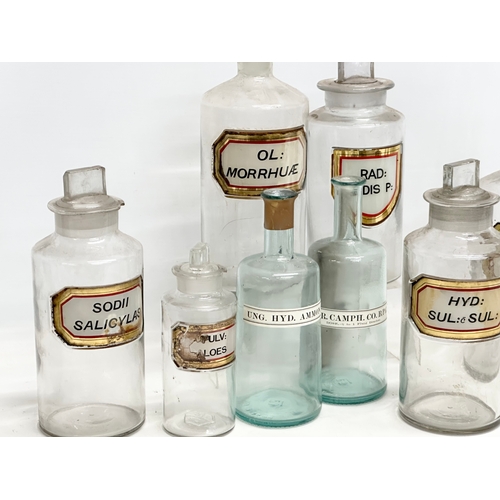 6 - A collection of late Victorian/Edwardian chemist bottles. Pair of largest 26cm. 3 measuring 23cm