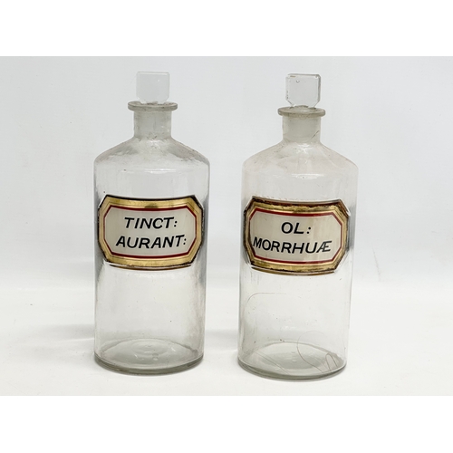 6 - A collection of late Victorian/Edwardian chemist bottles. Pair of largest 26cm. 3 measuring 23cm