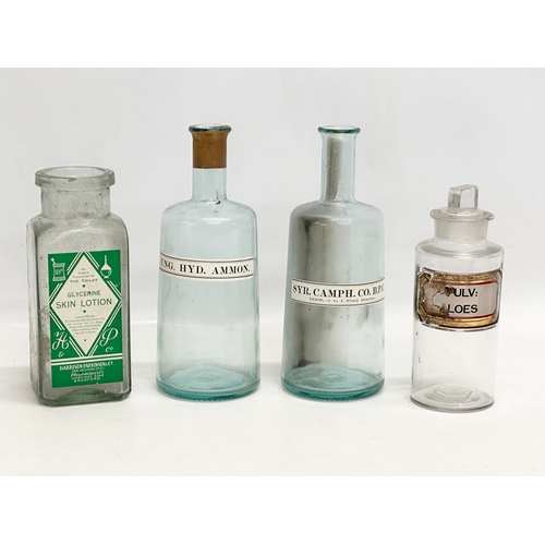 6 - A collection of late Victorian/Edwardian chemist bottles. Pair of largest 26cm. 3 measuring 23cm