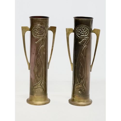 46 - A pair of early 20th century Art Nouveau copper and brass vases by Beldray. 31cm